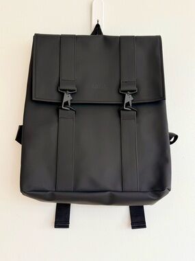LIKE NEW— RAINS Black Waterproof Backpack with Front Buckles — Minimal chic!